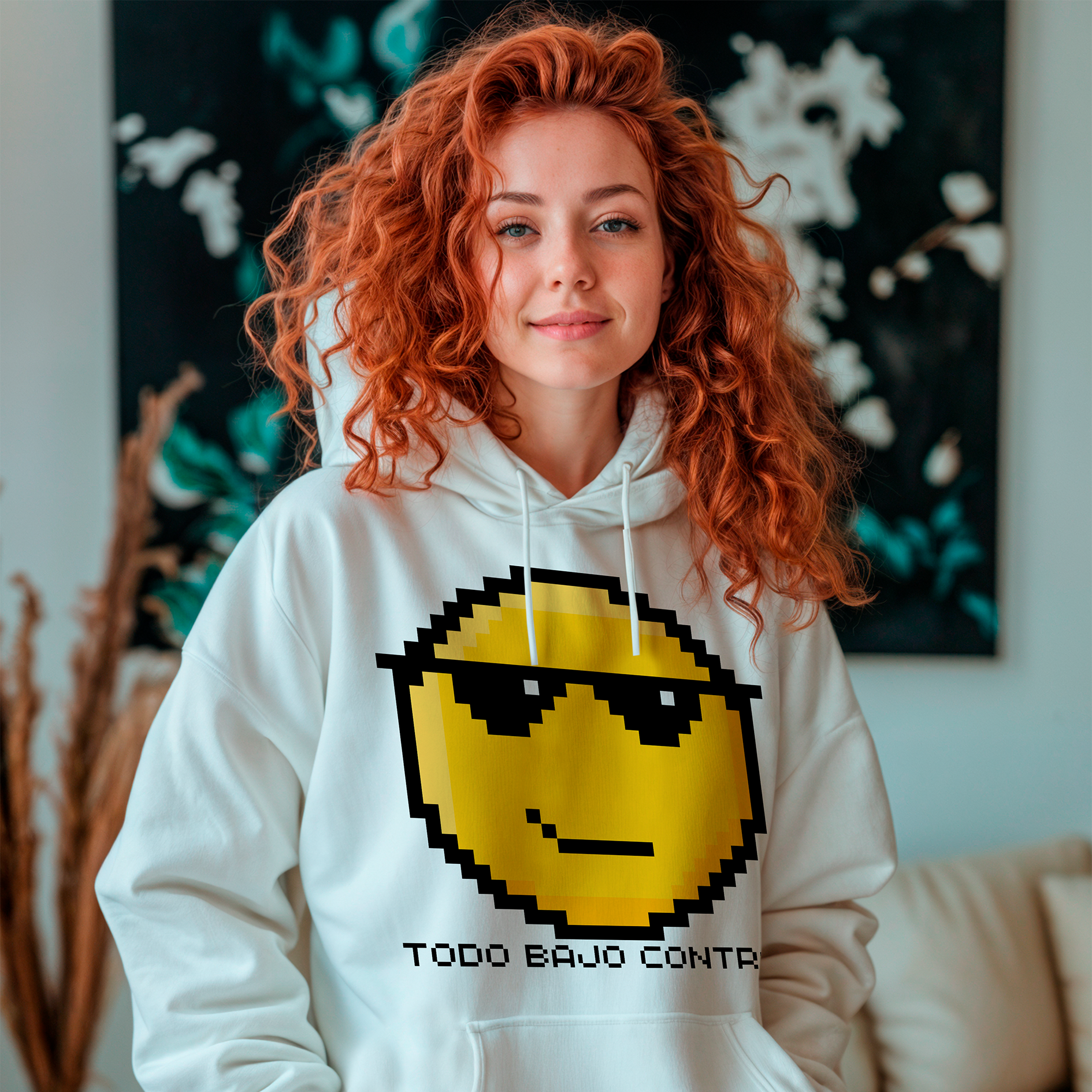 a woman with red hair wearing a sweatshirt with a smiley face on it